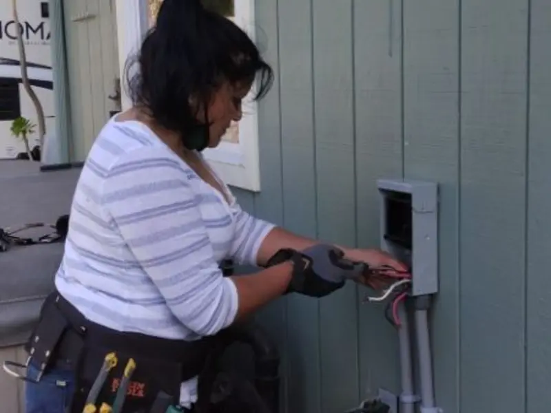 Licensed electrician wiring an exterior subpanel in Valley City