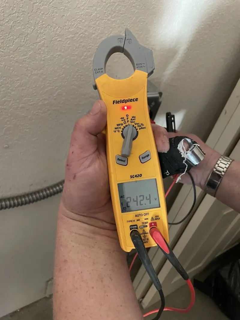 Voltage testing with clamp meter during Outlet Installation in Valley City